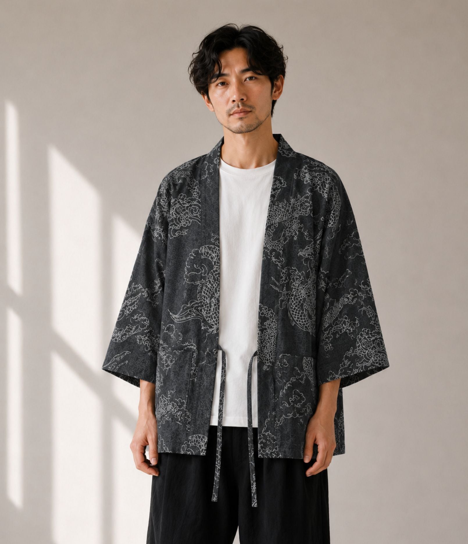 Man wearing a charcoal dragon-print haori jacket over a white tee