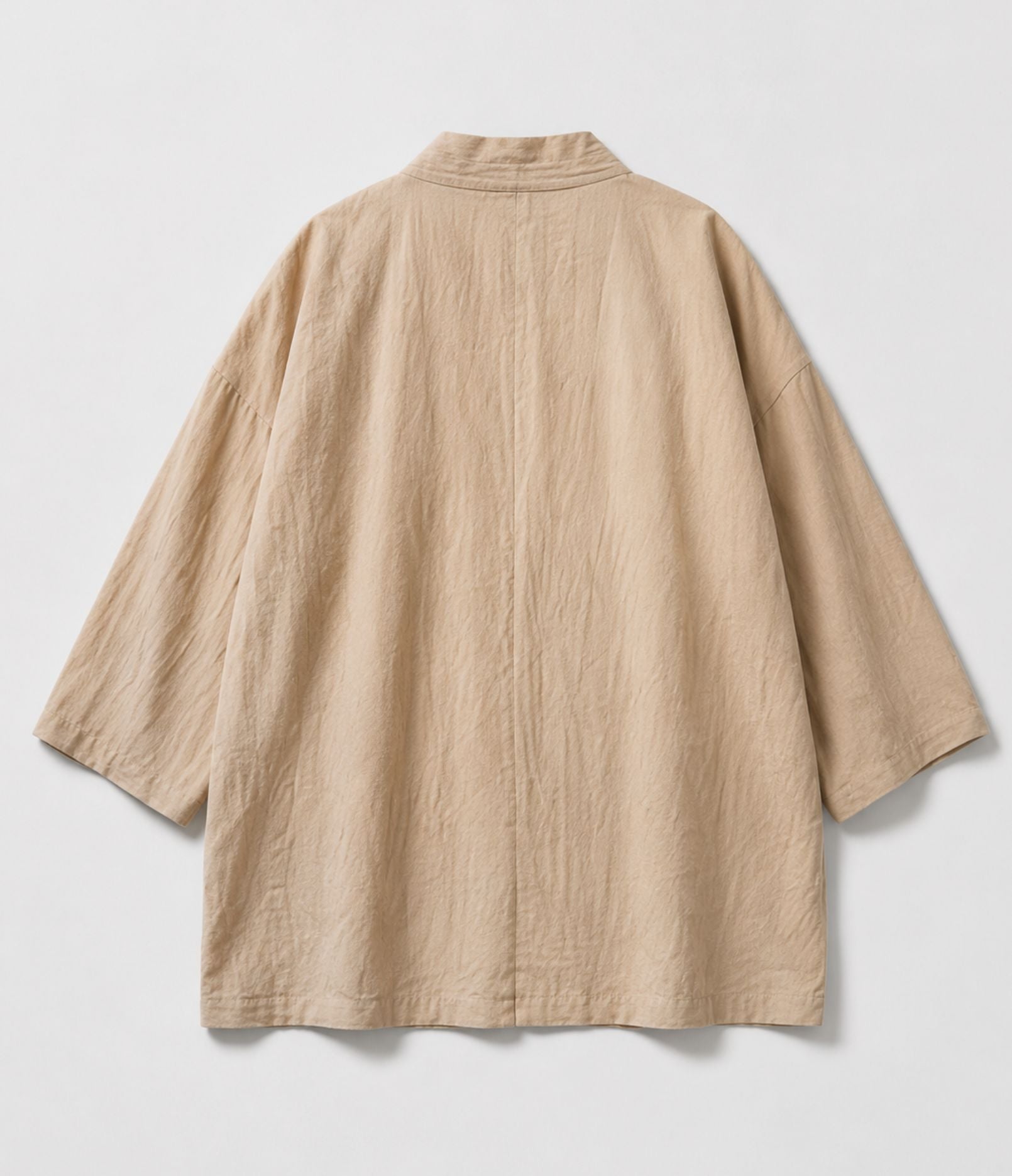 Back of a sand beige haori jacket showing collar and wide sleeves