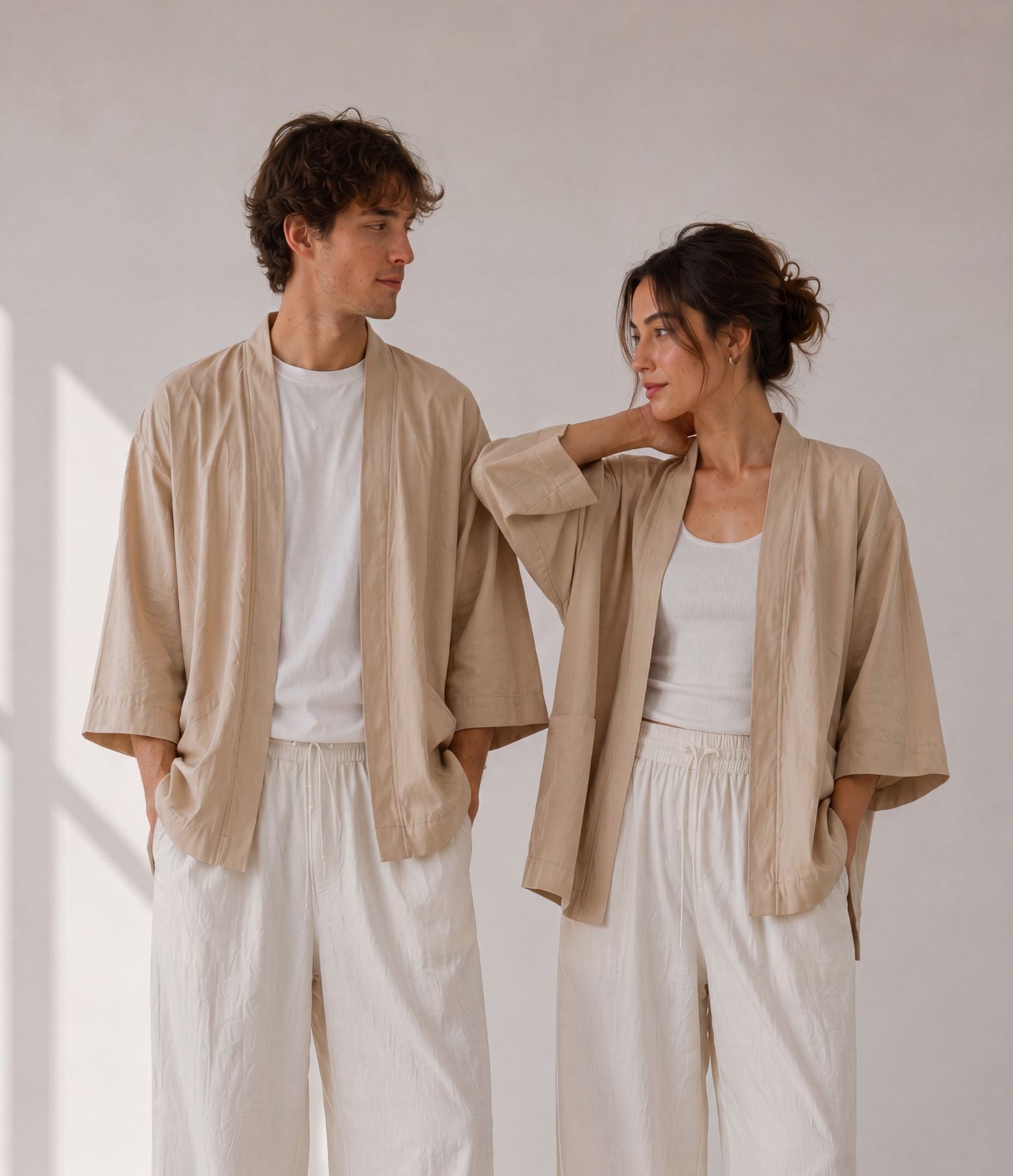 Man and woman in matching sand beige unisex haori jackets