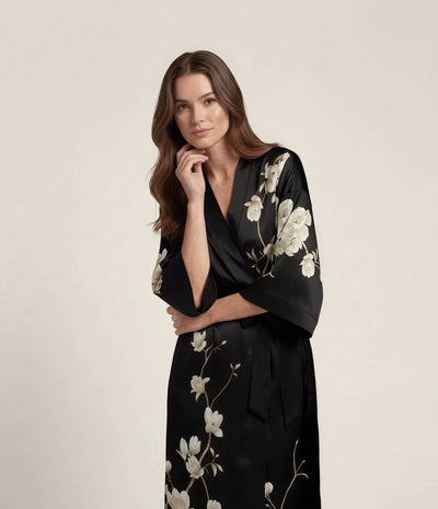 Front view of a black Japanese kimono robe for women with elegant floral print, long satin loungewear robe with waist belt.