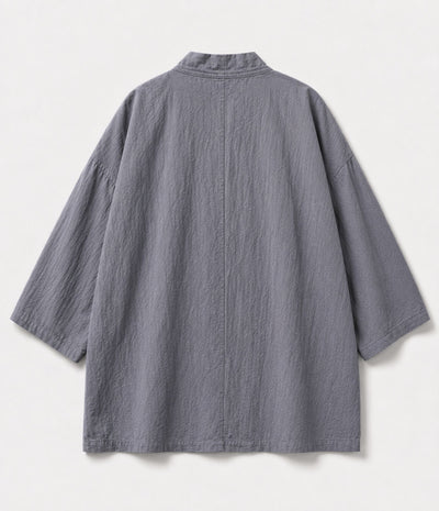 Back of a grey kimono jacket showing centre seam and wide sleeves