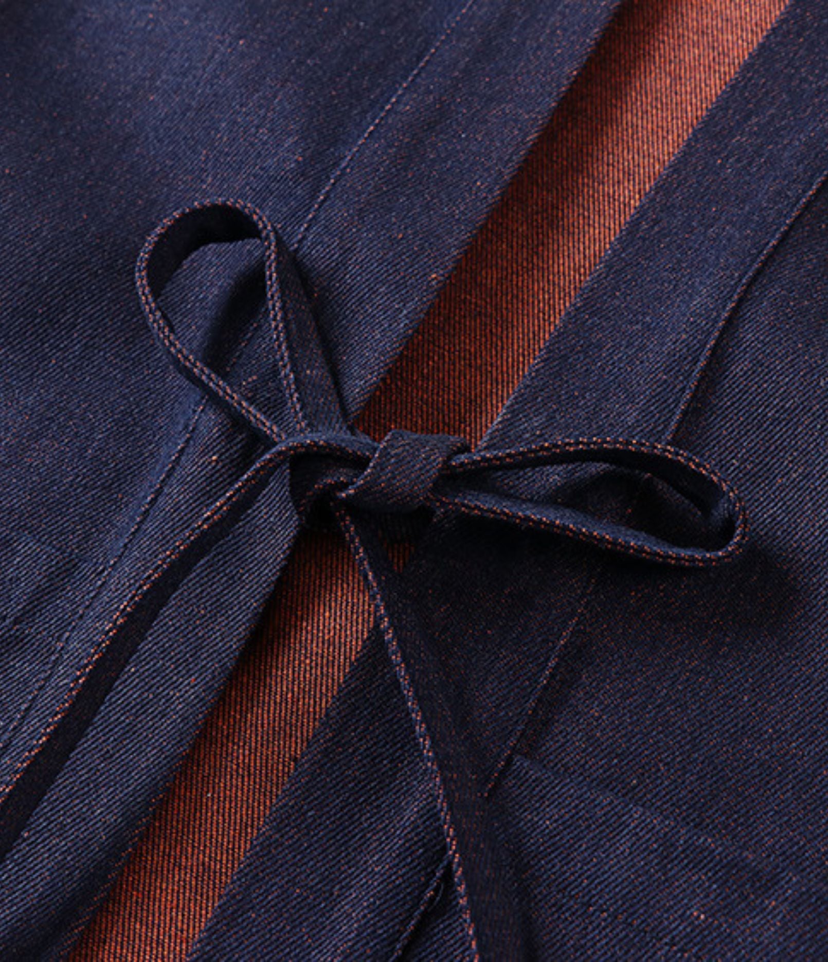 Close-up of the navy himo tie cords on a haori jacket