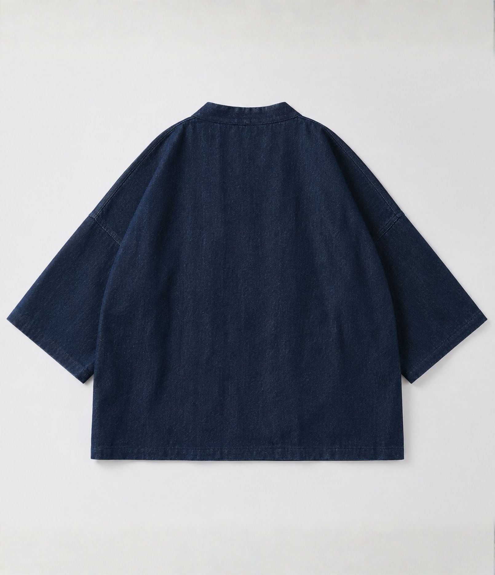 Back of the indigo denim side of a reversible green kimono jacket
