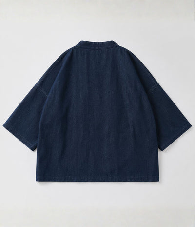 Back of the indigo denim side of a reversible green kimono jacket