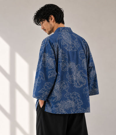 Back view of a man in an indigo denim dragon-print kimono cardigan