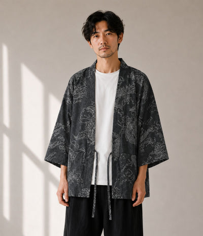 Man wearing a charcoal dragon-print haori jacket over a white tee