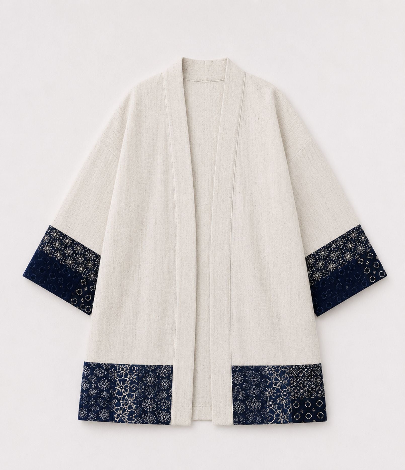 Natural linen haori jacket with indigo patchwork print sleeve and hem trim, front