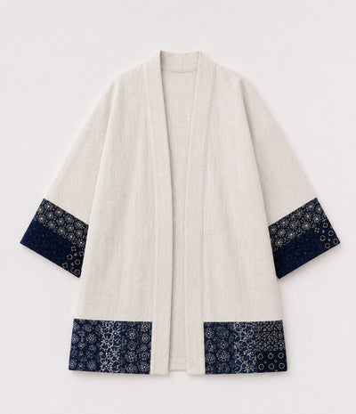 Natural linen haori jacket with indigo patchwork print sleeve and hem trim, front