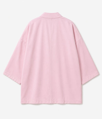 Back of a pink kimono jacket showing centre seam and wide sleeves