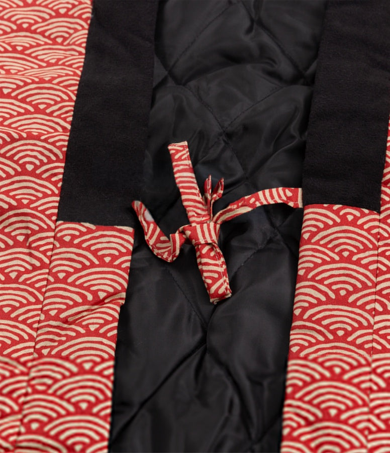 Close-up tie on red hanten, showing kimono coat men detail