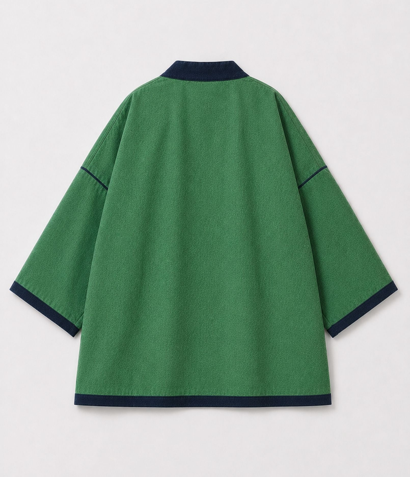 Back of a green reversible kimono jacket with contrast navy trim