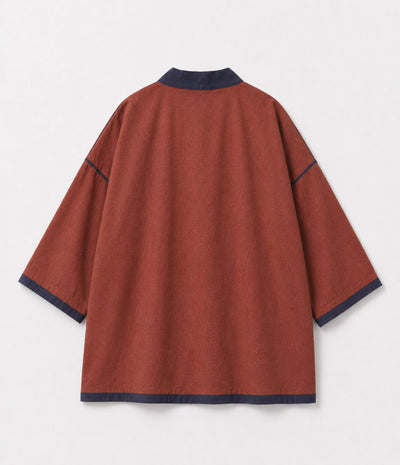 Back of a rust reversible kimono jacket with contrast navy trim