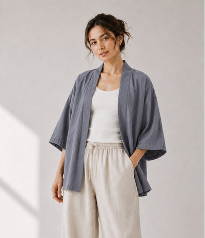 Woman wearing a lightweight grey haori jacket over a white tank top