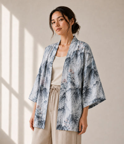 Woman wearing a grey lotus-print haori jacket over a beige tank top
