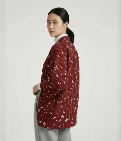 Side view of women’s red Japanese hanten jacket with sakura floral pattern